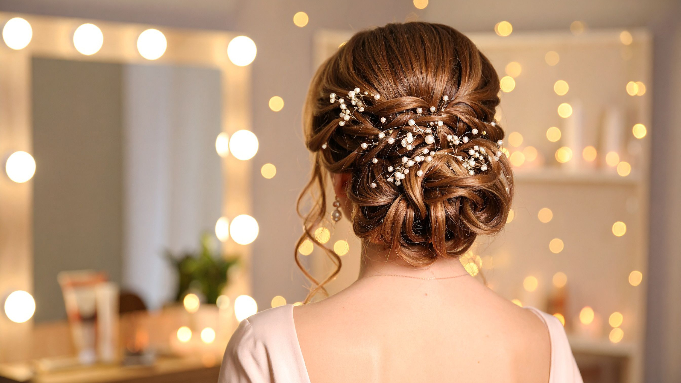 Romantic homecoming updo with pearl hair accessories styled at Salon de Allure